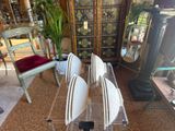 a glass table with a boat on it in the middle of a room