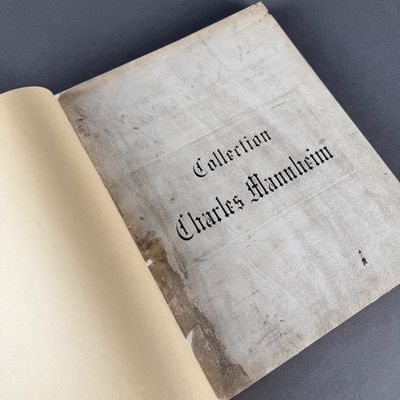 an open book with a black writing on it sitting on a table