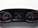 a close up of a car dashboard with gauges and numbers