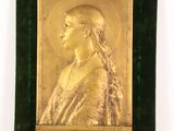 portrait of a woman in gold on a green velvet frame