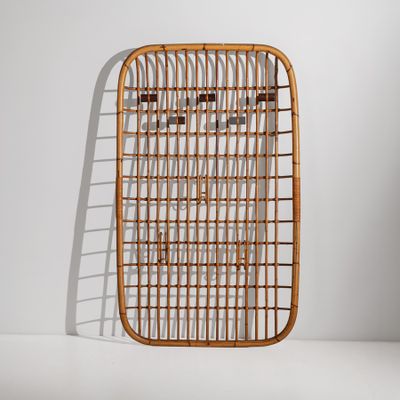 an image of a rattan chair against a white wall