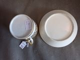 a white plate and a white bowl on a table