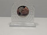 someone is taking a picture of themselves in the mirror of a small clock