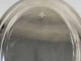 a silver plate that is sitting on a table
