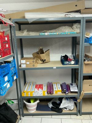 many boxes and boxes on the shelves in the room