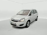 the small white car is parked in a white room