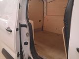 a white van with its doors open in a garage