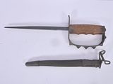 a knife and a knife holder on a white surface