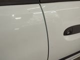 a close up of a car door handle with a sticker on it