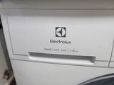 an image of a washing machine sitting in the corner of a room