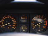 a close up of the dashboard of a car with various gauges