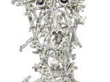 a metal sculpture of a face made out of tools
