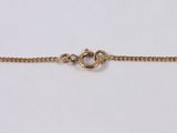 a gold plated chain with a clasp on a white background