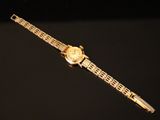 a watch that is sitting on top of a table