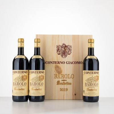 three bottles of wine in front of a wooden box