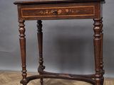 an old wooden table with a drawer on top of it