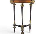 a small table with a wooden top and two legs