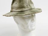a close up of a hat on a mannequin head