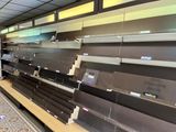 a lot of empty shelves in a store that is empty