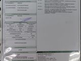 une photo d'un document sur lequel figure la photo d'une personne