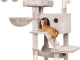 two cats that are sitting on a cat tree