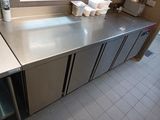 a stainless steel counter top in a commercial kitchen