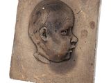 an image of a clay sculpture of a baby ' s head