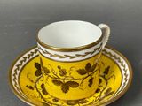 a cup and saucer on a saucer on a table
