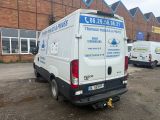 a white van that is parked in front of a building