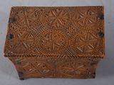 an old wooden box with a decorative design on it