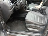 the interior of a car with the door open showing the driver ' s seat