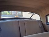 a view of the inside of a car from the back seat