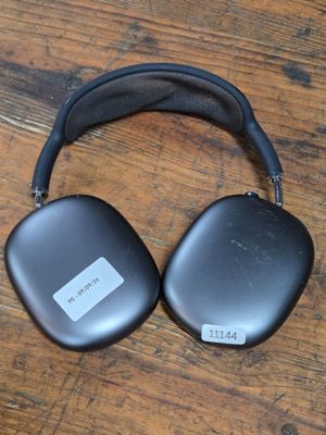 an image of a pair of headphones sitting on top of a wooden floor