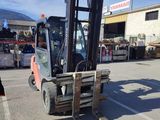 a forklift that is parked in a parking lot