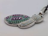 a keychain that has a turtle design on it
