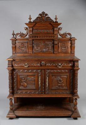 an old wooden cabinet with carvings and carvings on the top