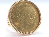 an image of a ring with a coin on it