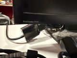 an image of a desk with a computer monitor and headphones