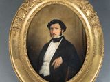 portrait of a gentleman in a tuxedo in a gold frame