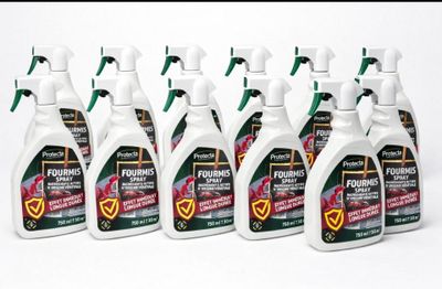 five bottles of liquid are lined up on a white surface