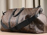 a brown and black duffel bag sitting on a table