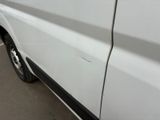 a white van parked on the side of the road
