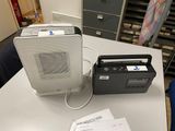 a radio and a cassette player sitting on a table