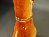 a close up of a vase on a table