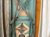 a suitcase with a blue cover and a pair of skis in it