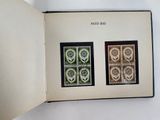 an open book with a picture of four different stamps on it