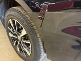 a close up of a car ' s tire with a sticker on it
