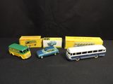 three toy cars and a bus are sitting next to each other