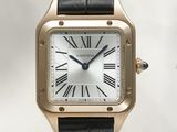 an image of a gold wrist watch with a black strap
