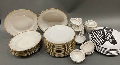 a lot of plates and bowls that are sitting on a table